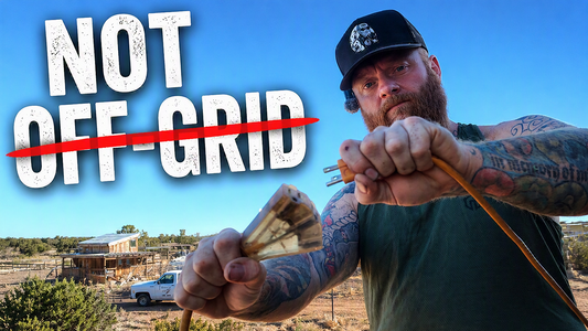 What does off-grid actually mean? definition of off grid, man holding extension chord and unplugging it on homestead